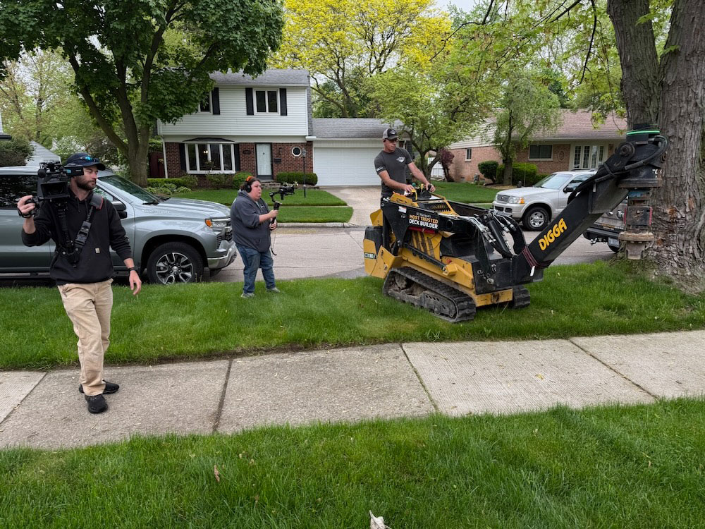 AHE film crew capturing deck construction branding